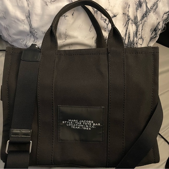 Marc Jacob’s. All black tote and white lettering. It is 13 inches. - Picture 2 of 7